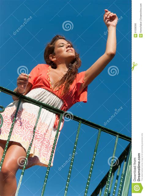 Beautiful Girl At Balcony With Fashion Dress And Hair