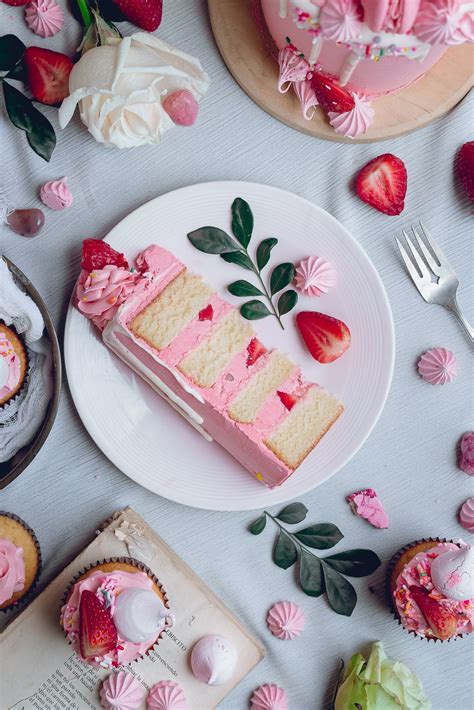 White Cake With Pink Frosting And Strawberry Meringue Kisses