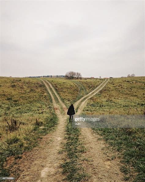 woman standing at a crossroads photo getty images