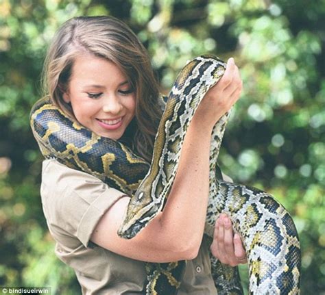 bindi irwin spends time tending to a rhino as she snubs