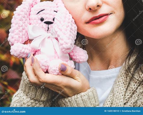 cute young woman holding  stuffed toy stock photo image  doll