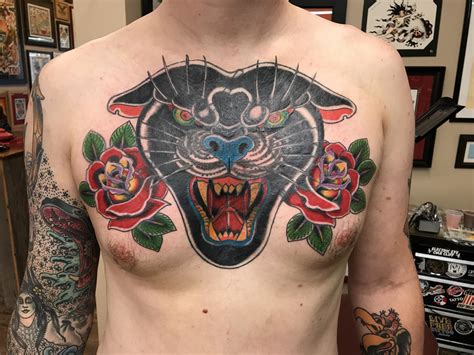 Roaring Black Panther With Flower On Man Chest
