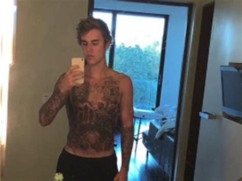 justin bieber got a full body tattoo and fans don t know how to feel