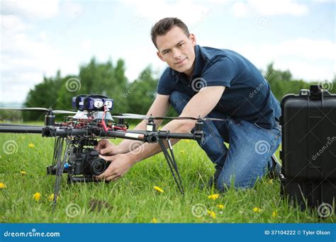 engineer setting camera  photography drone stock photo image  gimbal kneeling