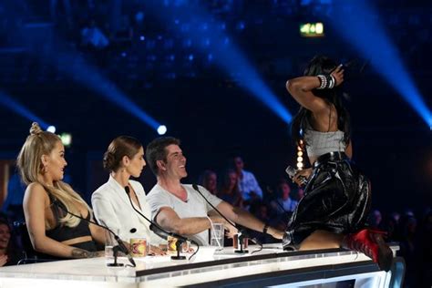 simon cowell can t stop grinning as x factor contestant gyrates in his