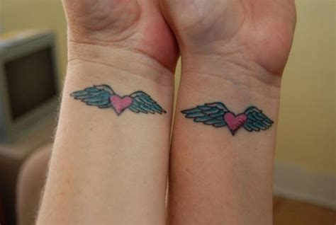 elegant angel wings tattoos  wrists