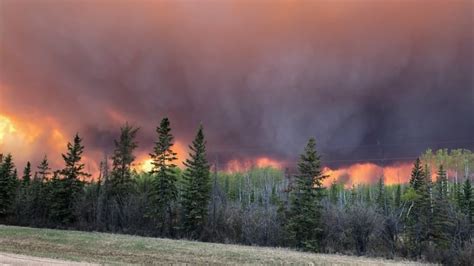 chuckegg creek wildfire burns   control  alberta canada evacuations power outages