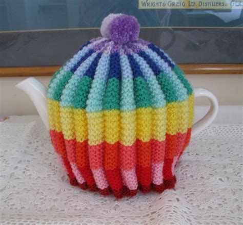 shortbread ginger rainbow knitted tea cosy