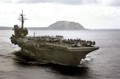 military  uss kitty hawk transits  iwo jima