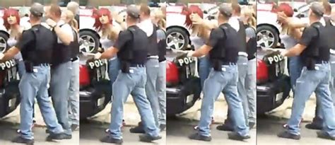 video shows handcuffed woman punched by police officer in