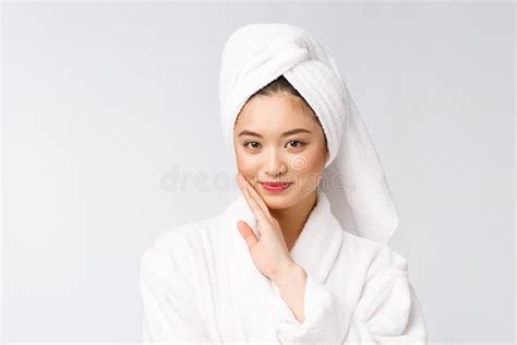 spa skincare beauty asian woman drying hair with towel on head after