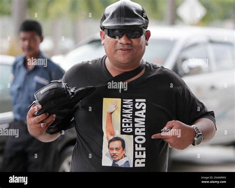 A Supporter Of Malaysian Opposition Leader Anwar Ibrahim Points At A T