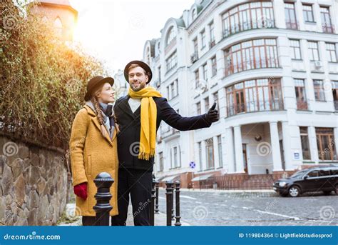 young beautiful couple catching taxi stock photo image  outfit happy