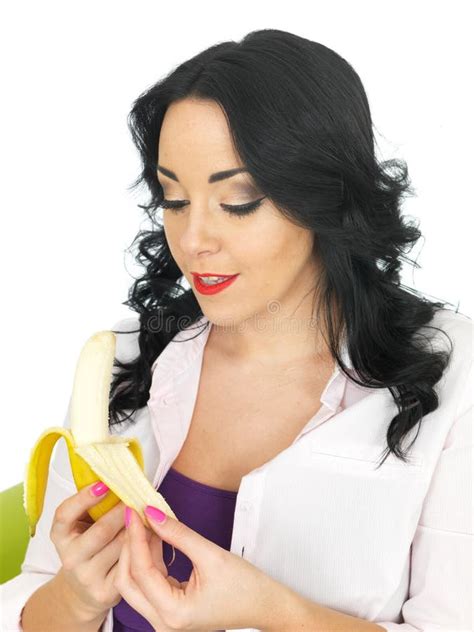 Healthy Attractive Young Woman Peeling A Ripe Banana Stock Image
