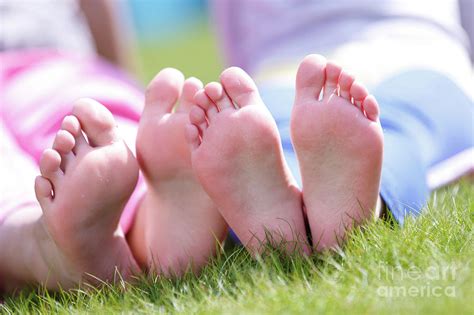 girls bare feet on grass photograph by wladimir bulgar science photo