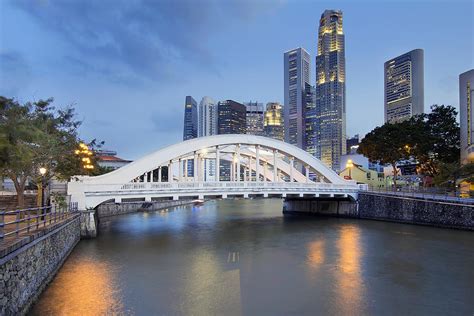 singapore skyline by elgin bridge along river photograph