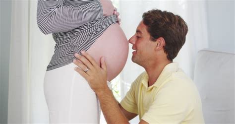 Excited Husband Kissing Pregnant Womans Stock Footage