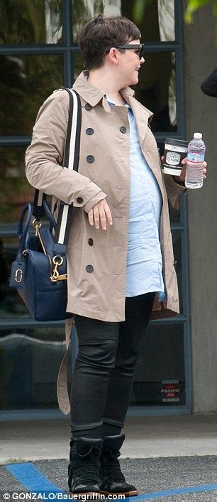 ginnifer goodwin wraps bump up in a trench coat while out