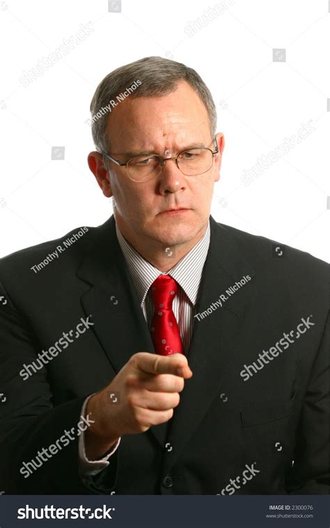 businessman   face  pointing finger stock photo