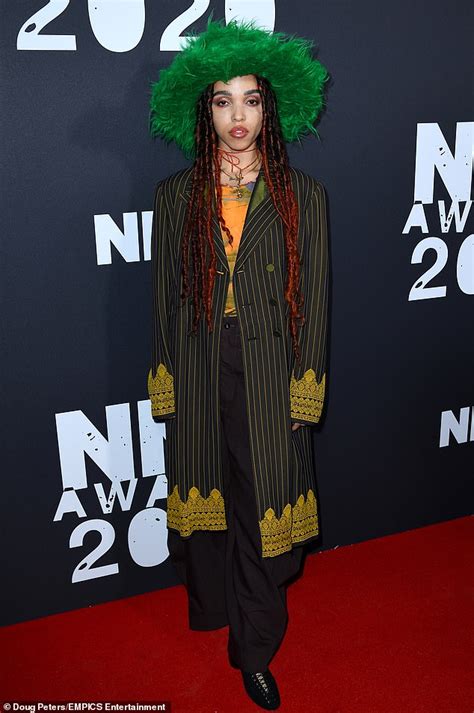 nme awards 2020 fka twigs looks typically quirky in a green fur hat and pinstripe blazer jacket