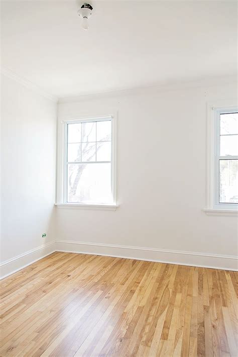 simply white bm walls  trim  white oak floors white wall paint
