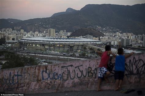 rio s poor watch olympic opening from rooftops of slum daily mail online