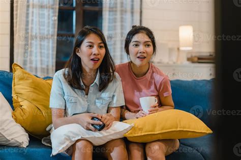 Lesbian Lgbt Women Couple Watching Television At Home Asian Female
