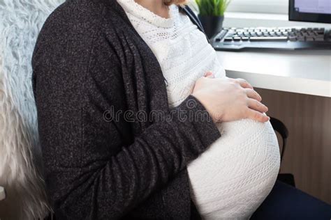 Pregnant Woman In Office Workplace With Belly Employment During