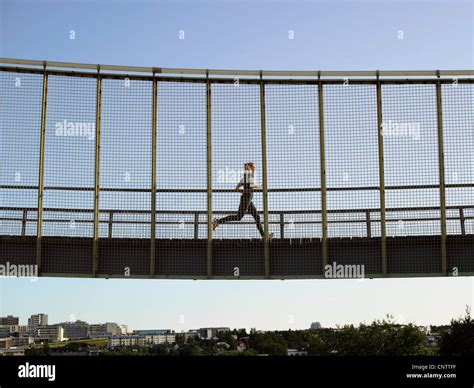 runner crossing skybridge  res stock photography  images alamy