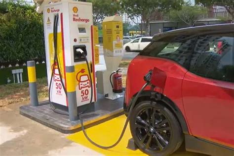 shell launches singapores  ev charger  service stations