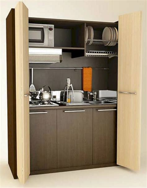 small kitchen   open door leading   sink  microwave oven