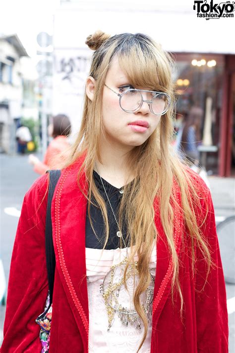 long blonde hair double hair buns and retro glasses tokyo