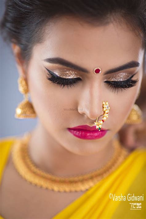 photo of marathi bride makeup with shimmery eyes and bright pink lips
