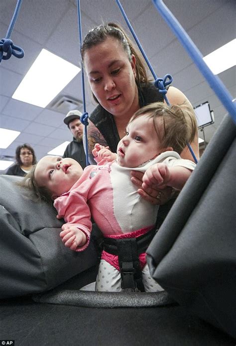 Conjoined Twin Girls In Us Receive Custom Made Bouncer Daily Mail Online