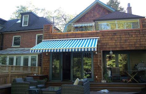 blue  white striped awning rolltec retractable awnings toronto ontario canada