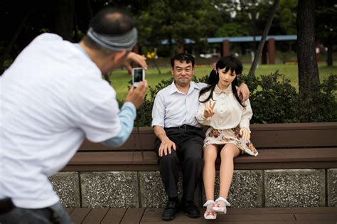 intimate portraits of japanese men and their sex dolls enjoying picnics