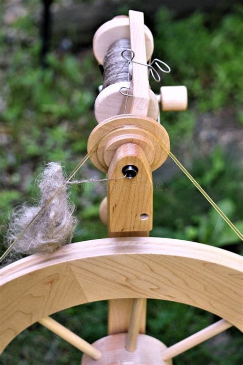 closeup  spinning wheel  bobbin filled  linen stock photo