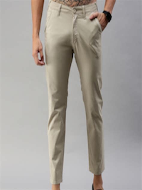 buy herenow men beige slim fit solid regular trousers trousers  men  myntra