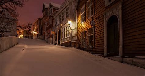 gamlebergen norway norway night winter snow roads houses clocks lights city light