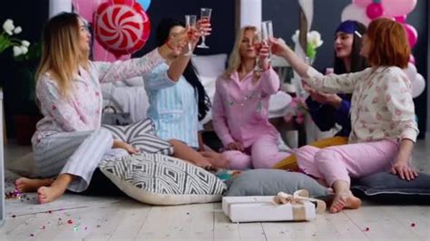 A Group Of Dancing Girls At A Pajama Party With Glasses Of Champagne