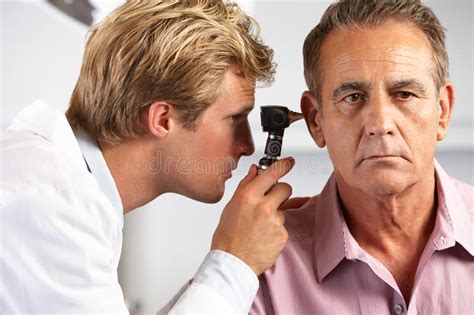 doctor examining male patient  ears stock image image  patient