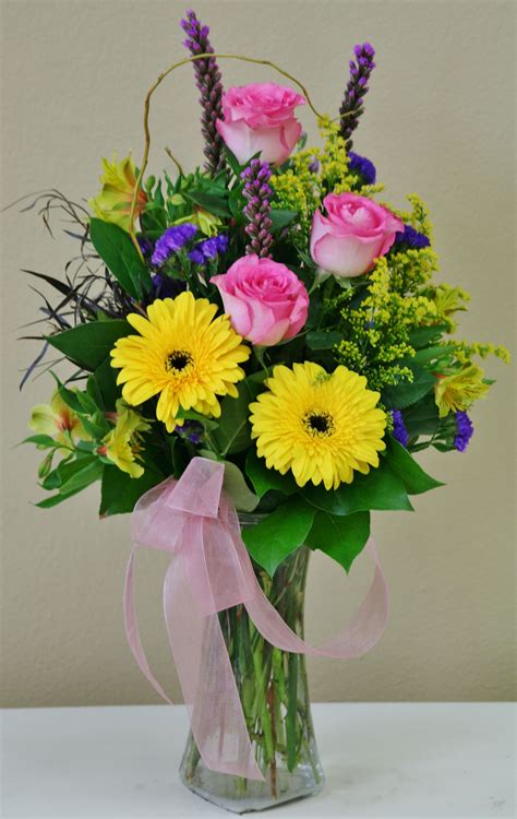 Spring Flowers In Yellow Pink And Purple Flowers By
