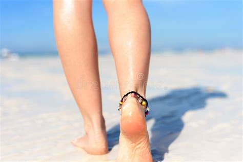 beach travel concept legs  tropical sand beach walking female feet