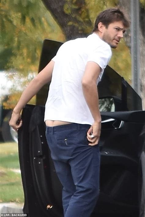 ashton kutcher flashes his backside in slouchy bottoms while stepping