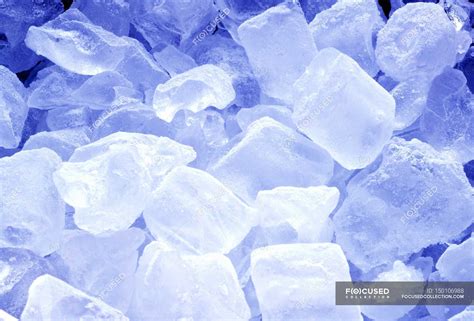 deep frozen ice cubes indoor background stock photo