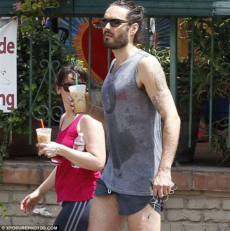 russell brand goes for a run in very short shorts and knee high socks daily mail online