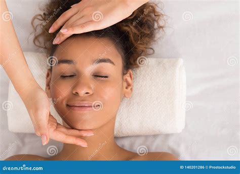 african american woman  face spa treatment crop stock photo