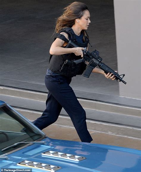 Jessica Alba Takes A Break From Running With A Gun On Set For A Stroll