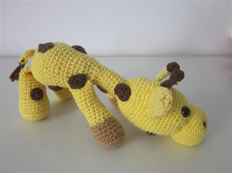 crocheted giraffe laying   side
