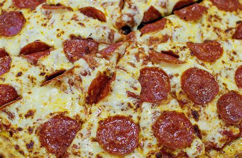little caesars is now serving pizza stuffed with three feet of cheese